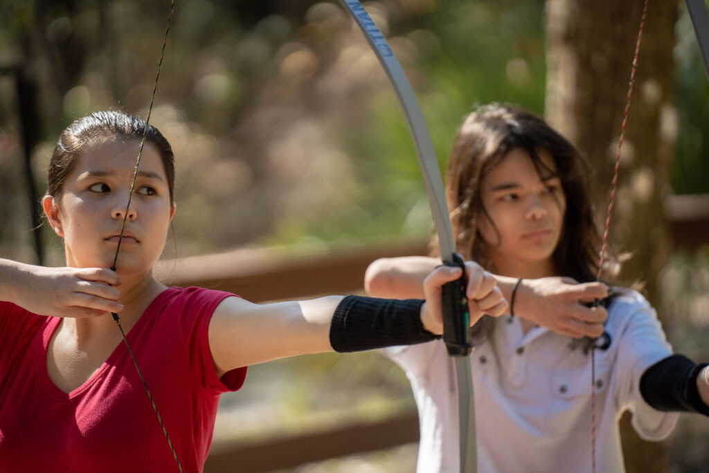 Gabe and Angelica, shooting archery