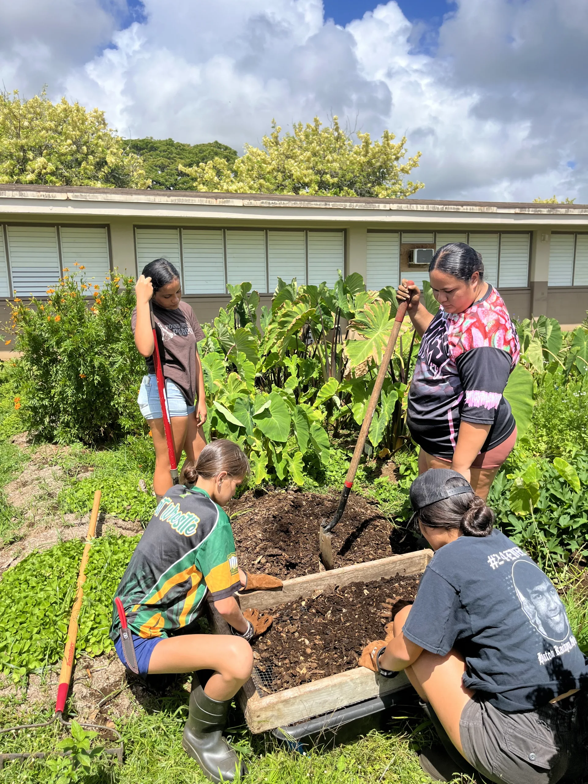 Children in a Ma Ka Hana Ka ‘Ike garden program