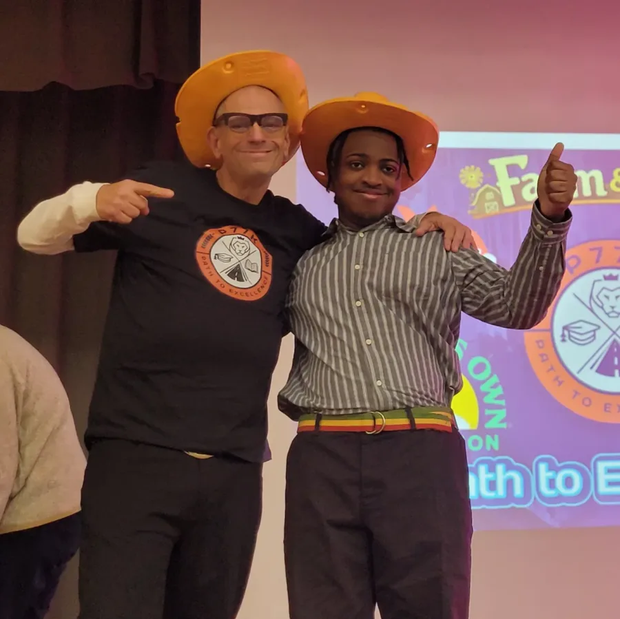 Green Bronx Machine's Stephen Ritz with Josiah Lessie in cheese hats.