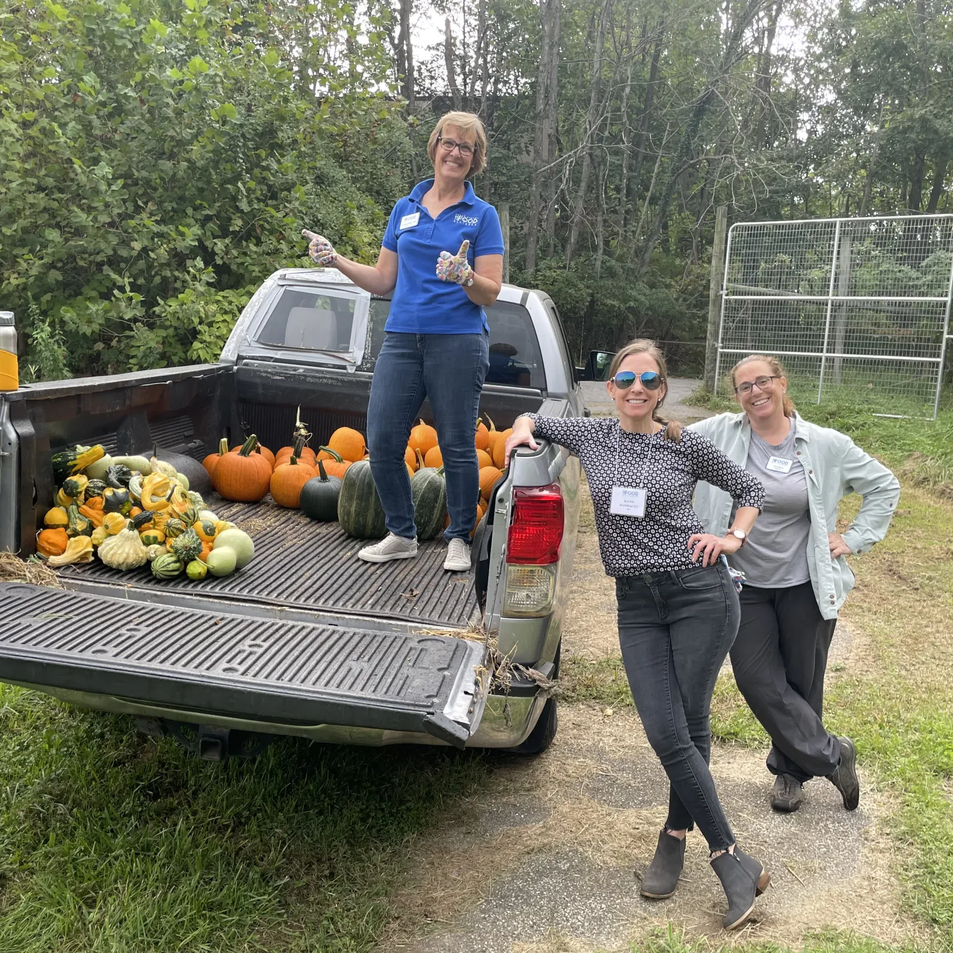 Katie Wilson and team members with a truck of pumpkins.