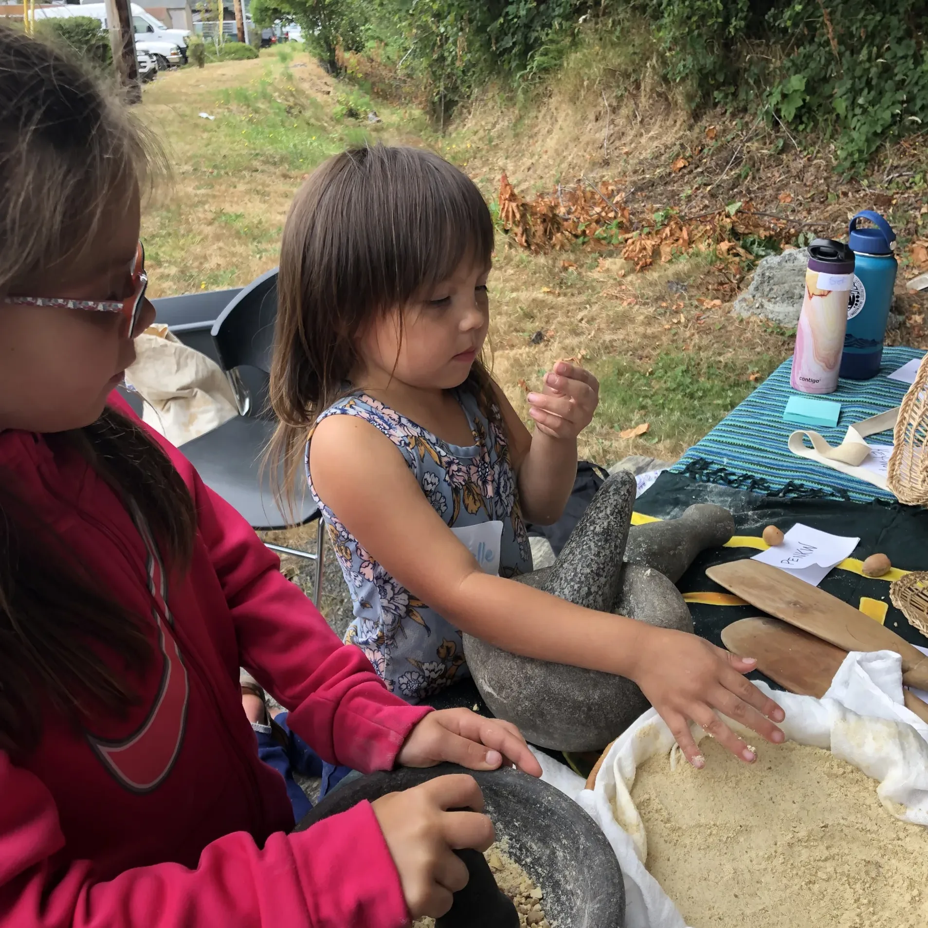 A young person making traditional food.